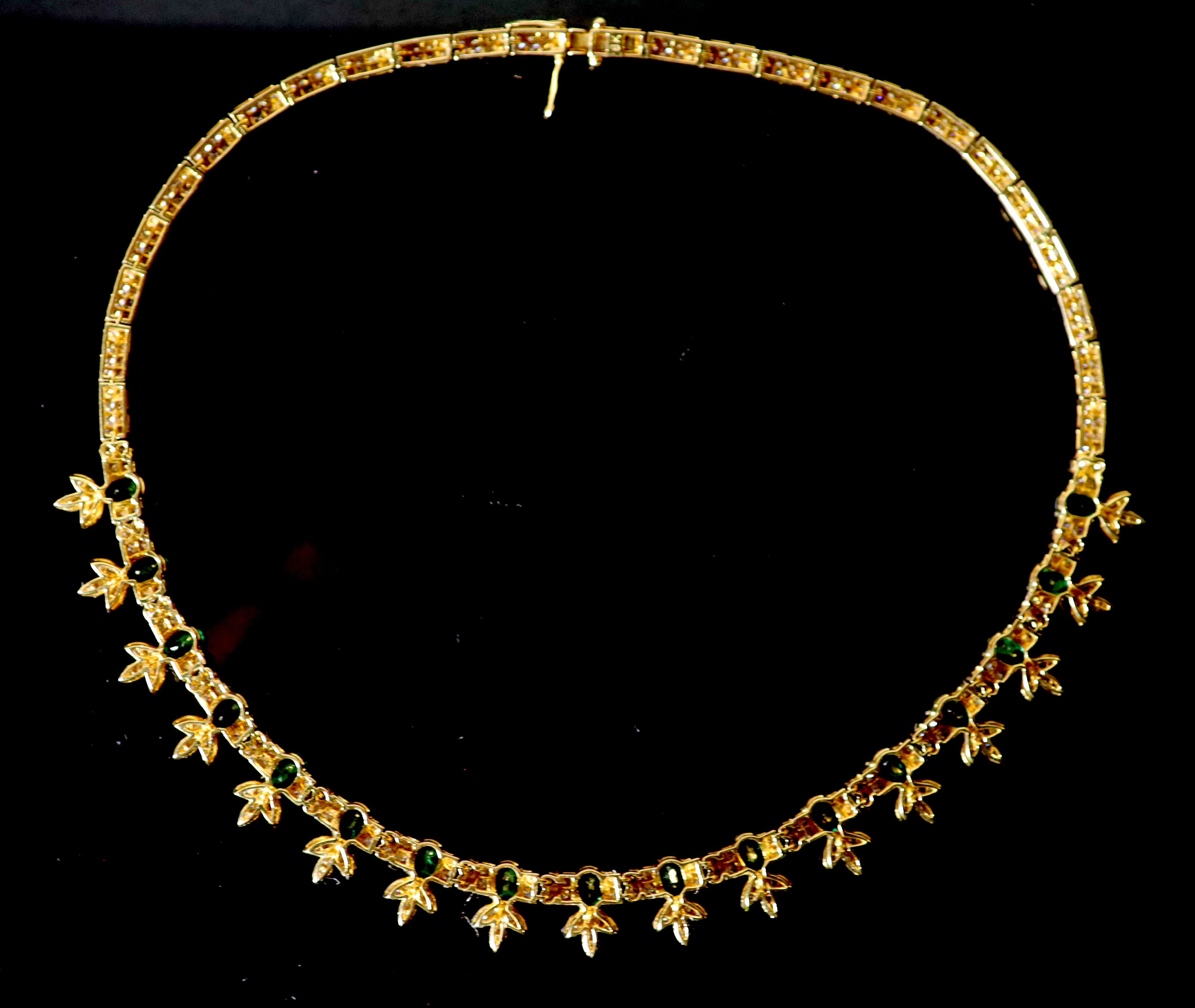 An attractive modern 18k gold, emerald and diamond cluster set choker necklace,